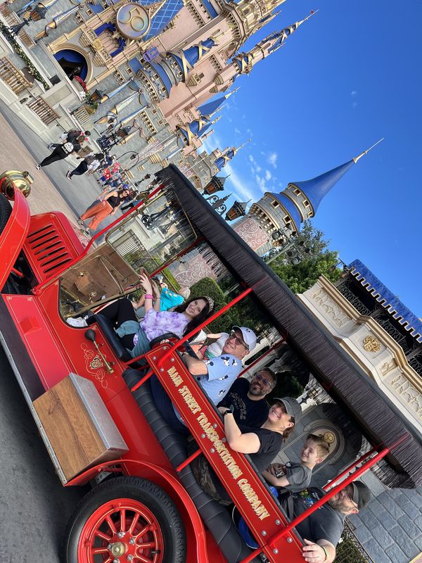 We got to have a family Disney first and get a ride down Main Street USA. Photo by Cast Member:-)